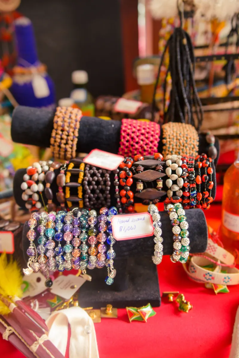 Handmade beaded bracelets displayed on a stand